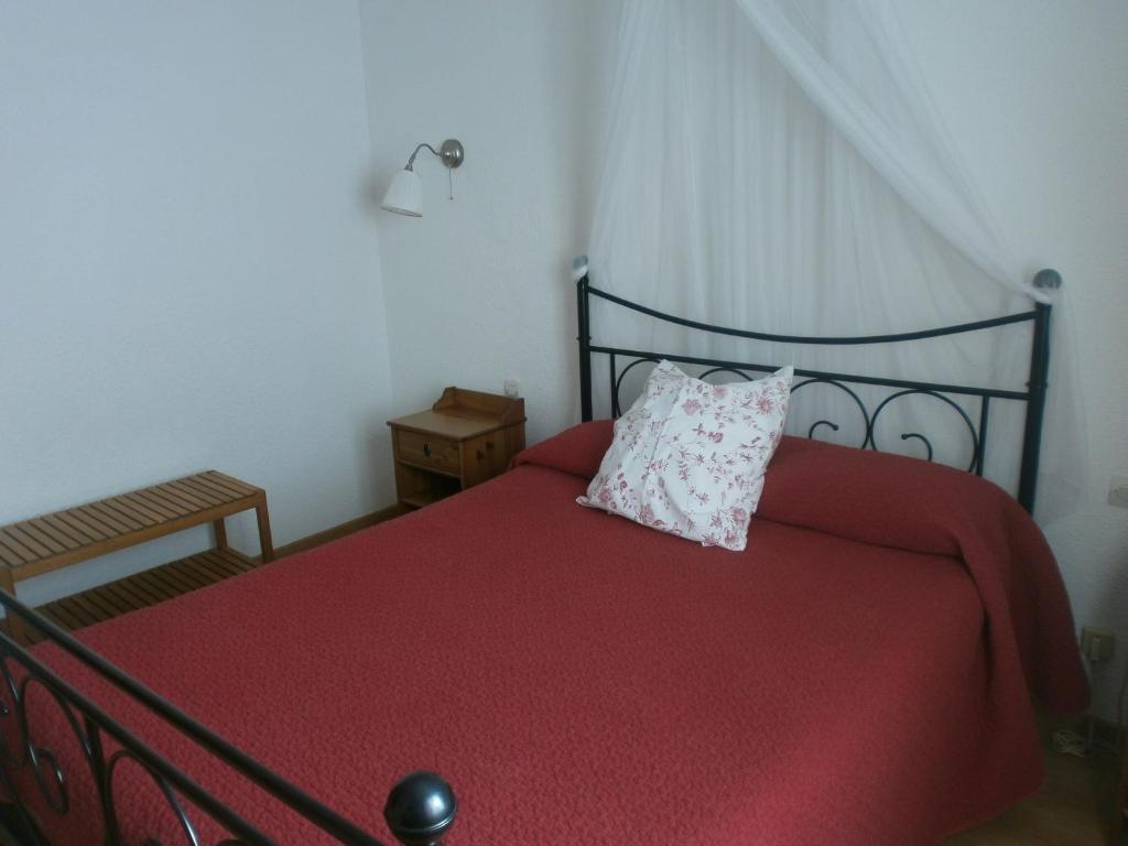 Postel nebo postele na pokoji v ubytování Hôtel Le Clos des Pins