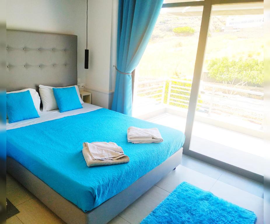 Posteľ alebo postele v izbe v ubytovaní Rethymno Hills Apartments