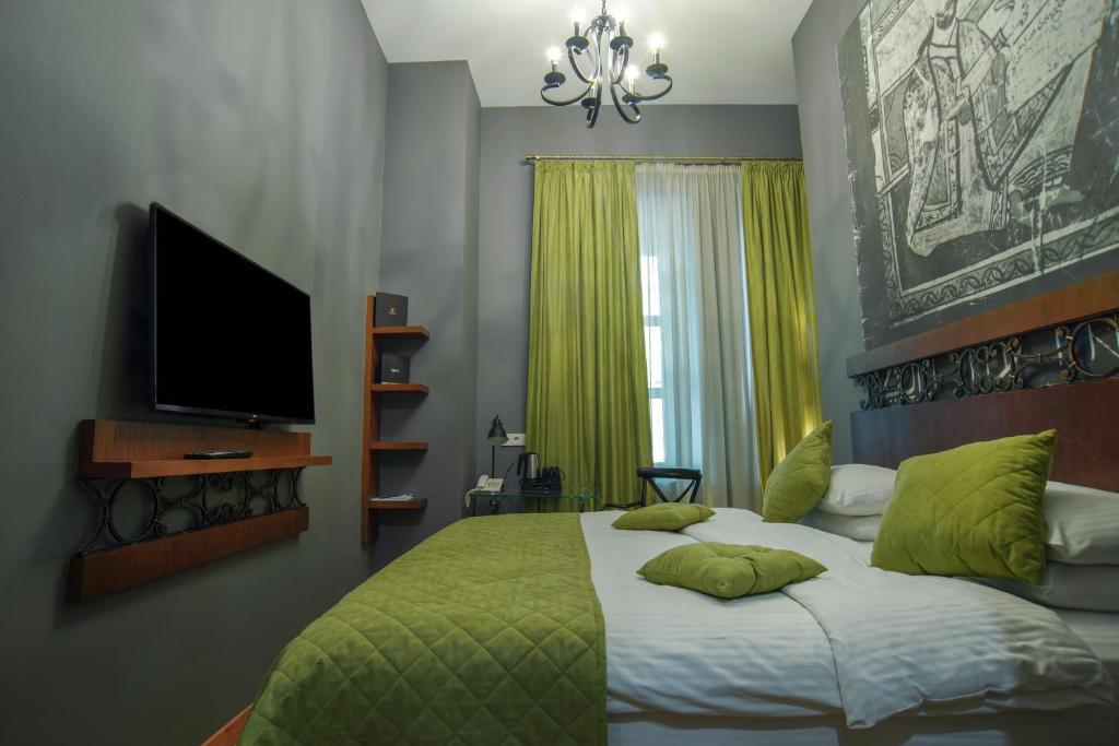 Postel nebo postele na pokoji v ubytování Badagoni Boutique Hotel Rustaveli