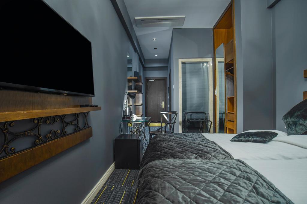 Postel nebo postele na pokoji v ubytování Badagoni Boutique Hotel Rustaveli