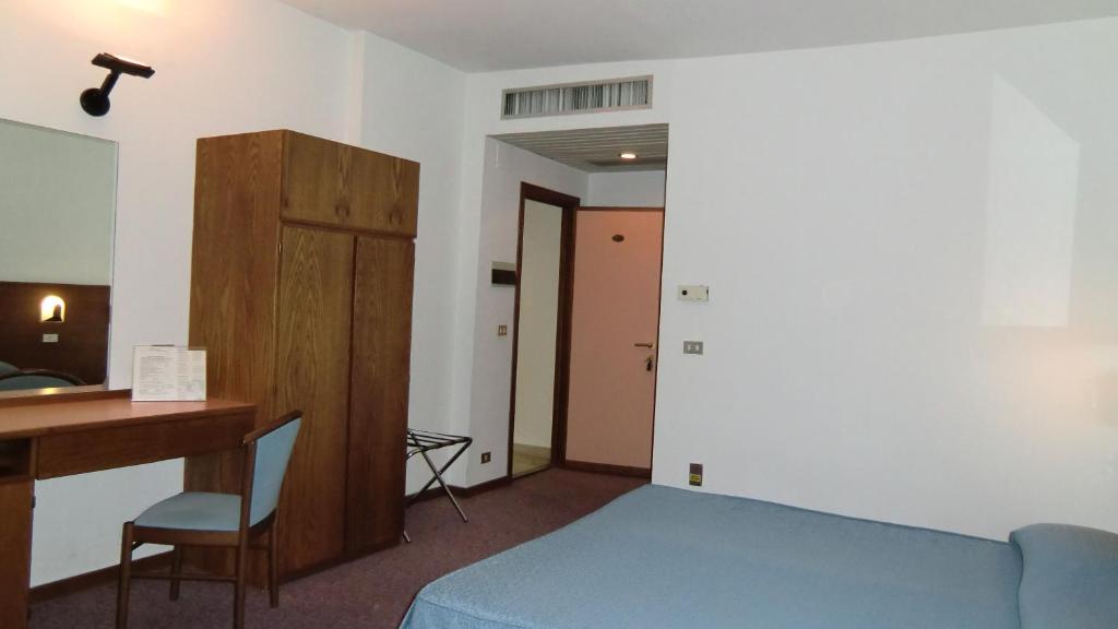 Postel nebo postele na pokoji v ubytování Hotel Giardino