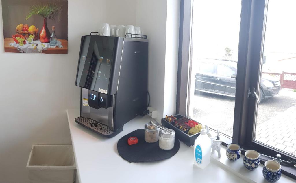Příslušenství pro přípravu čaje a kávy v ubytování Apotek Guesthouse