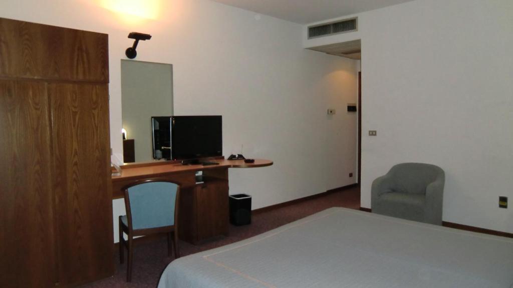 TV a/nebo společenská místnost v ubytování Hotel Giardino