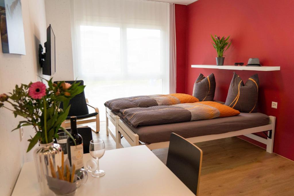 a living room with a couch and a table at Anstatthotel Horw - self-check-in in Luzern