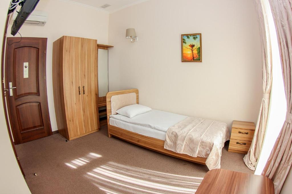 Postel nebo postele na pokoji v ubytování Hotel 52