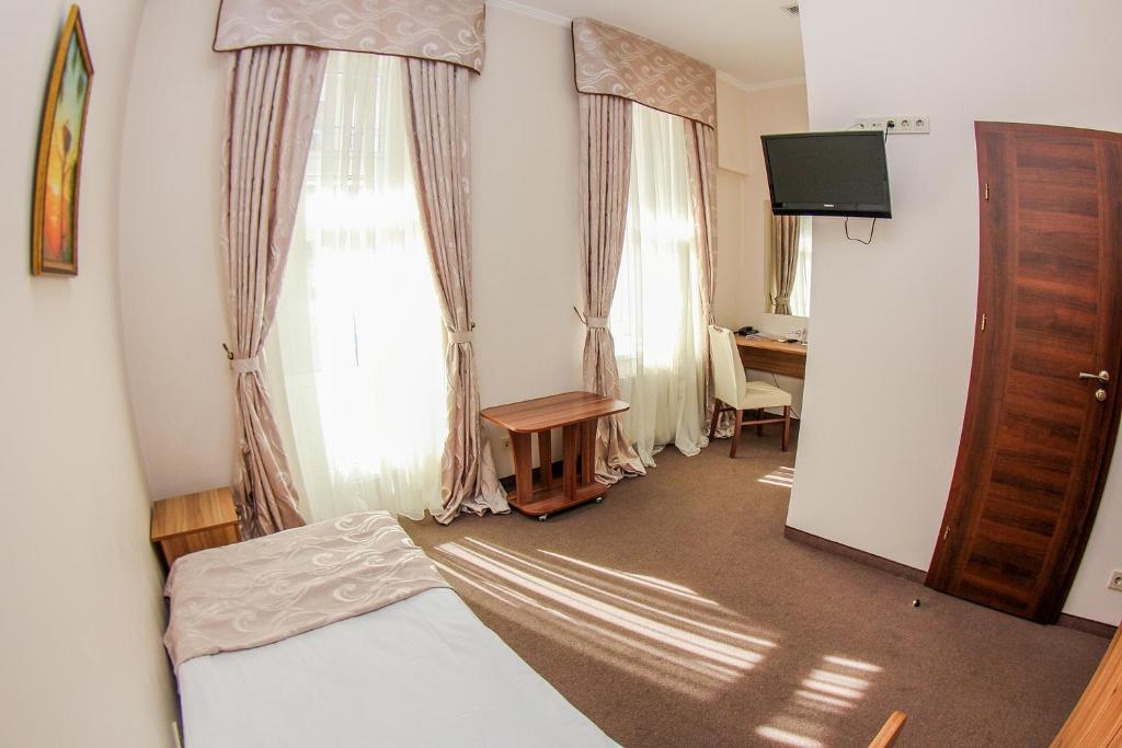 TV a/nebo společenská místnost v ubytování Hotel 52