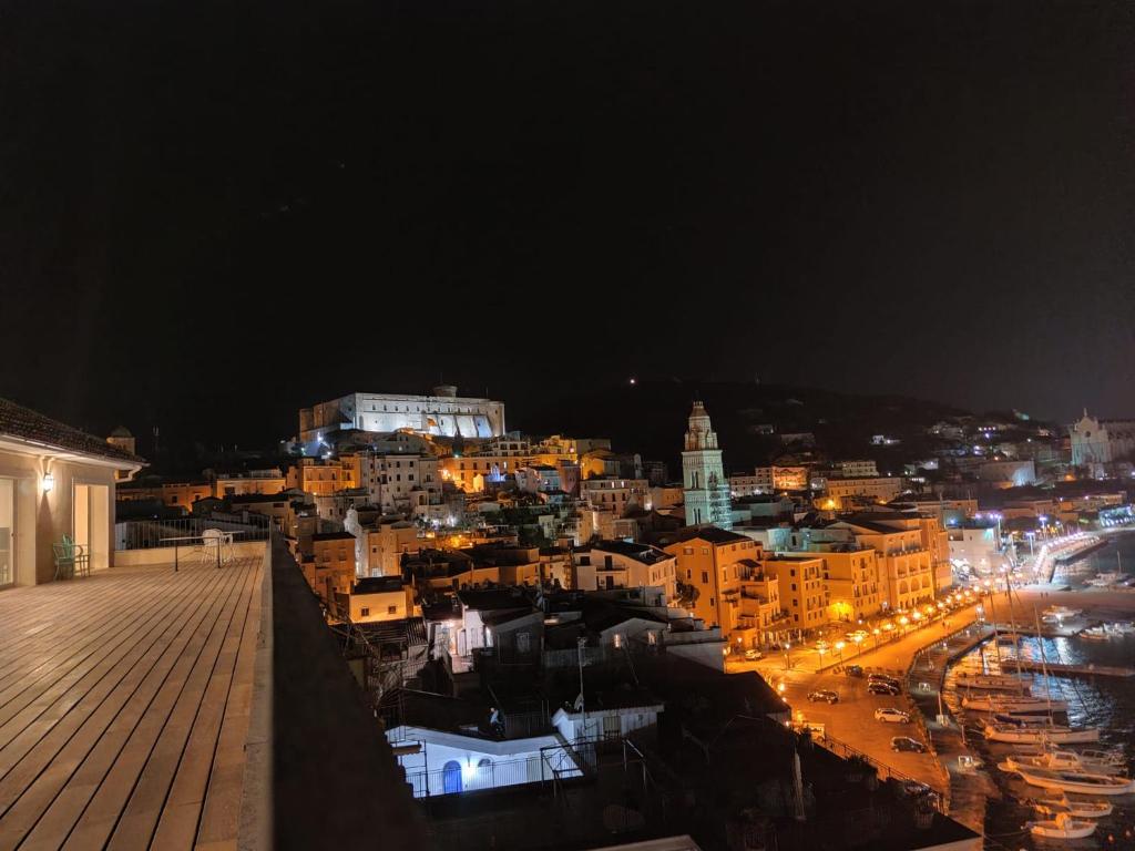 a view of a city at night with lights at Residenza Punta Stendardo in Gaeta