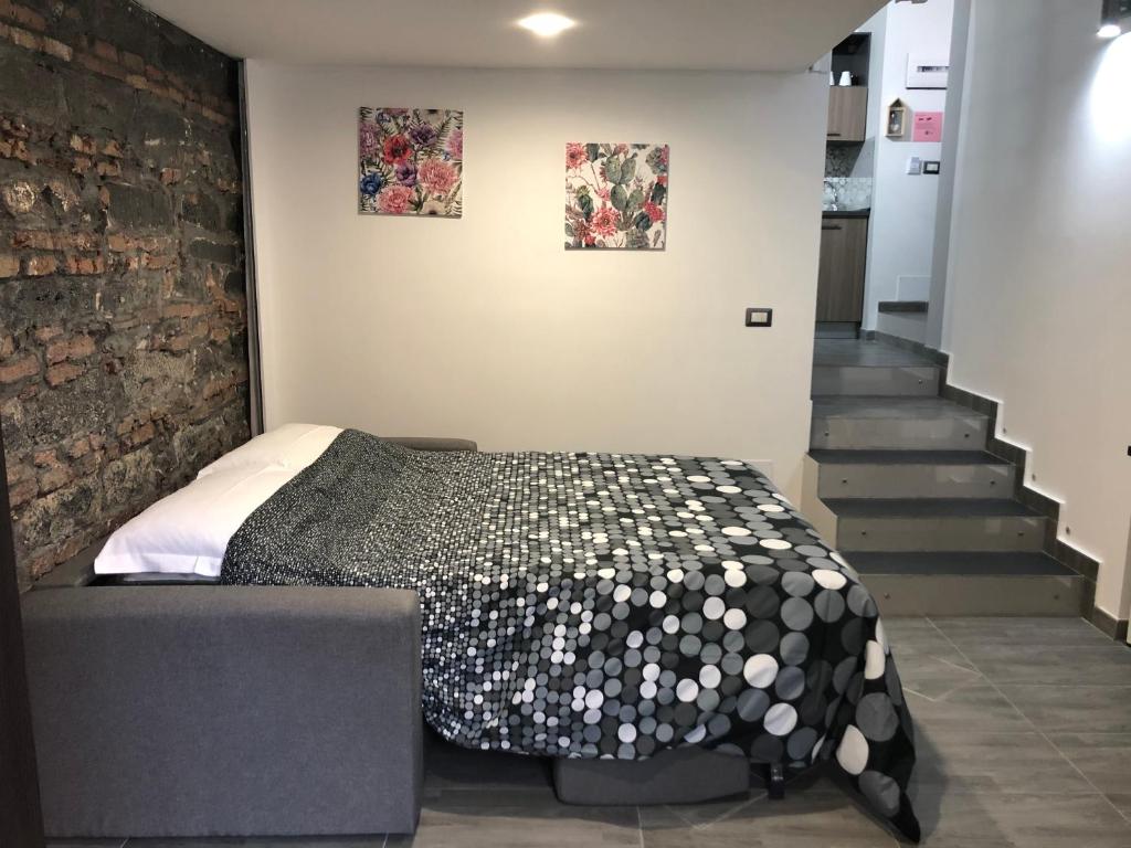 A bed or beds in a room at La Casa di Karola