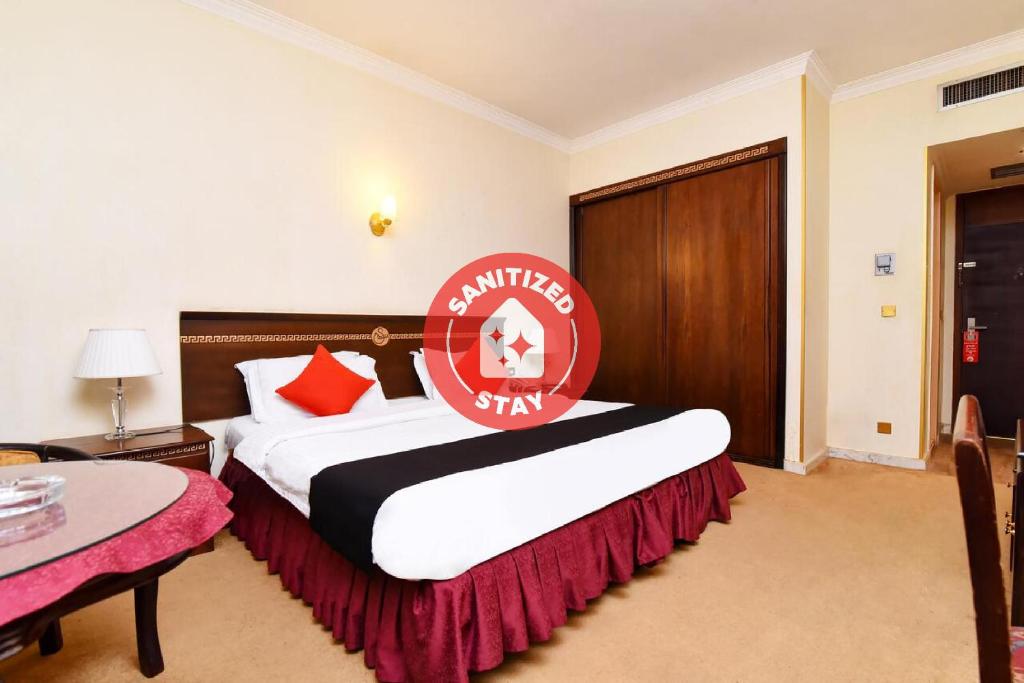 Cama o camas de una habitación en Capital O 419 Al Safeer Hotel