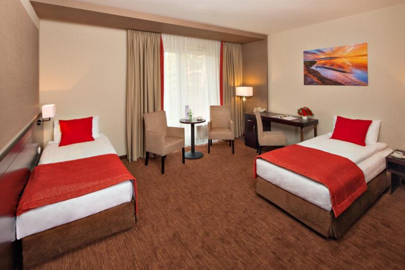 Postel nebo postele na pokoji v ubytování Z-Hotel Business & Spa