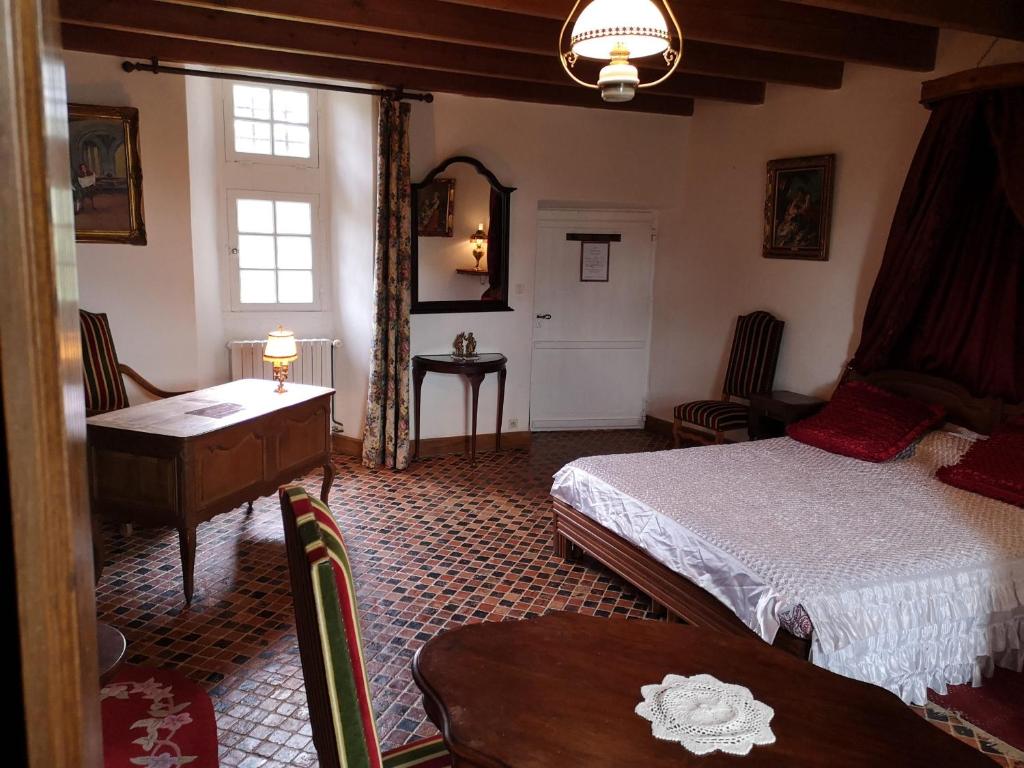 Postel nebo postele na pokoji v ubytování Manoir de la Foulerie