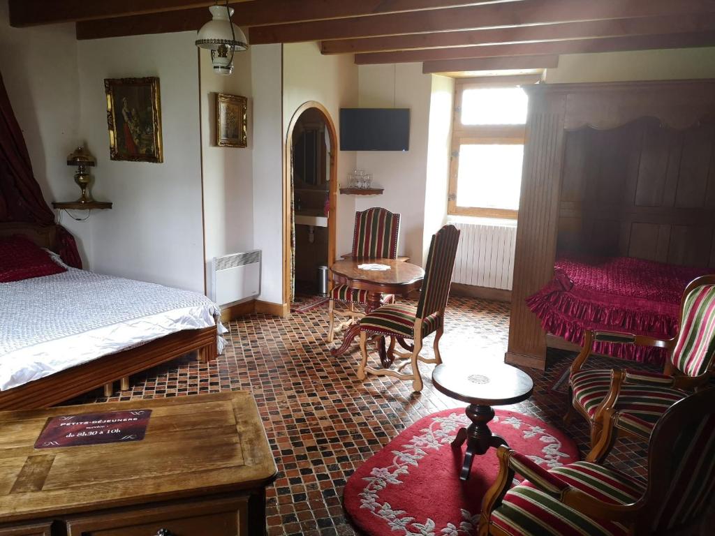 Postel nebo postele na pokoji v ubytování Manoir de la Foulerie