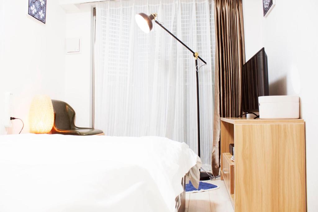 Postel nebo postele na pokoji v ubytování Hotel Shu