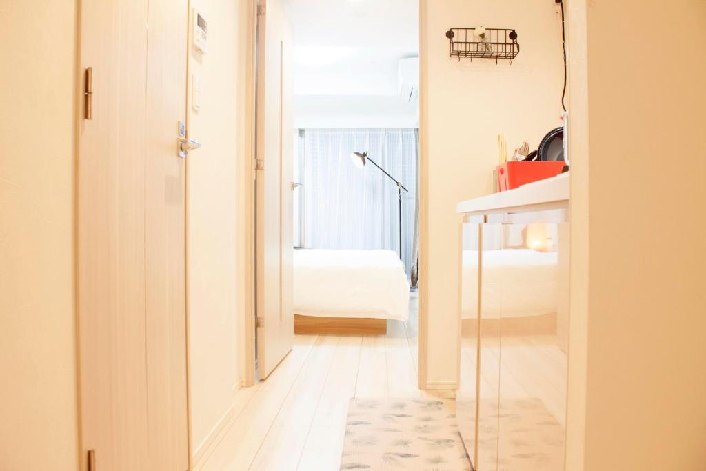 Postel nebo postele na pokoji v ubytování Hotel Shu