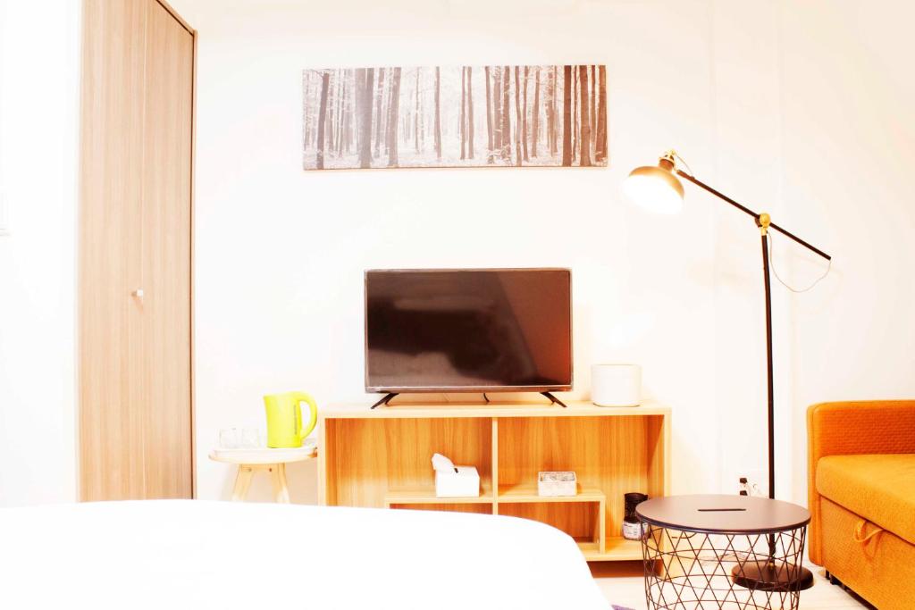 TV a/nebo společenská místnost v ubytování Hotel Shu