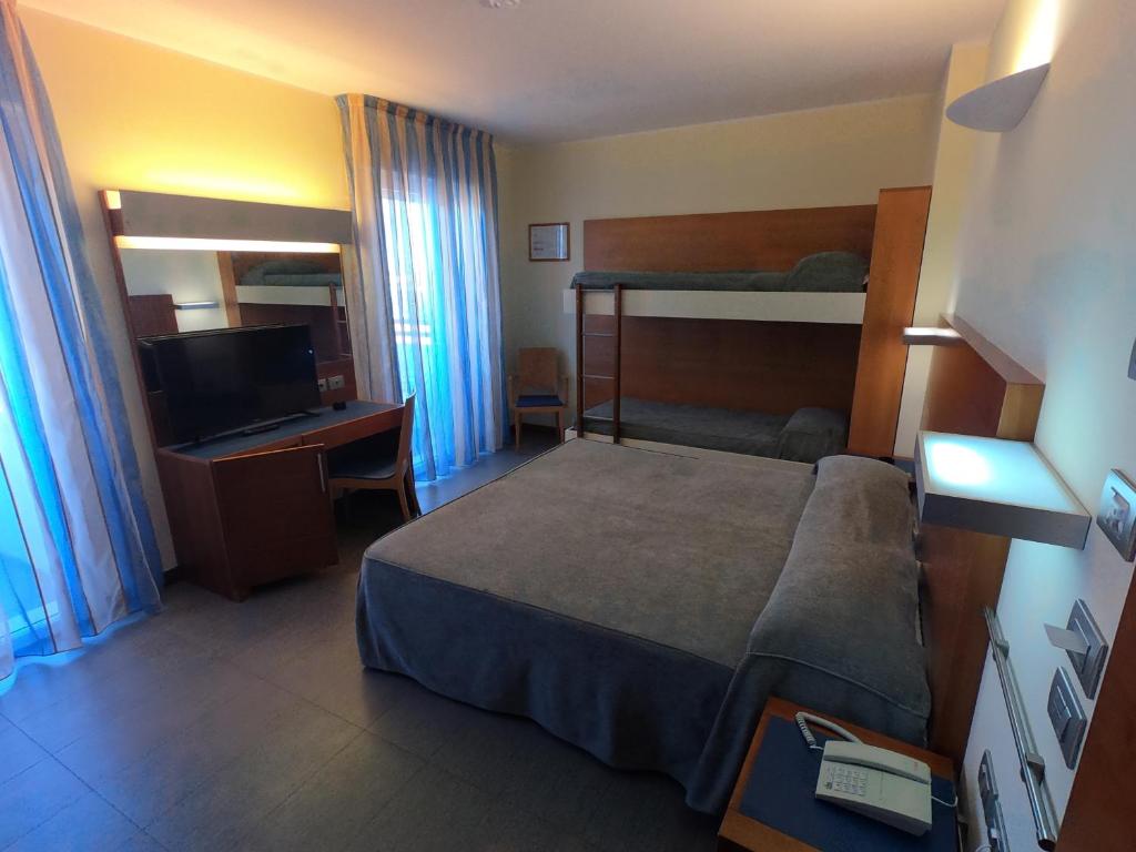 Postel nebo postele na pokoji v ubytování Hotel Coppe Jesolo