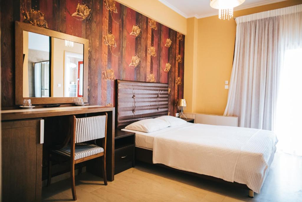 Postel nebo postele na pokoji v ubytování Fanari Hotel