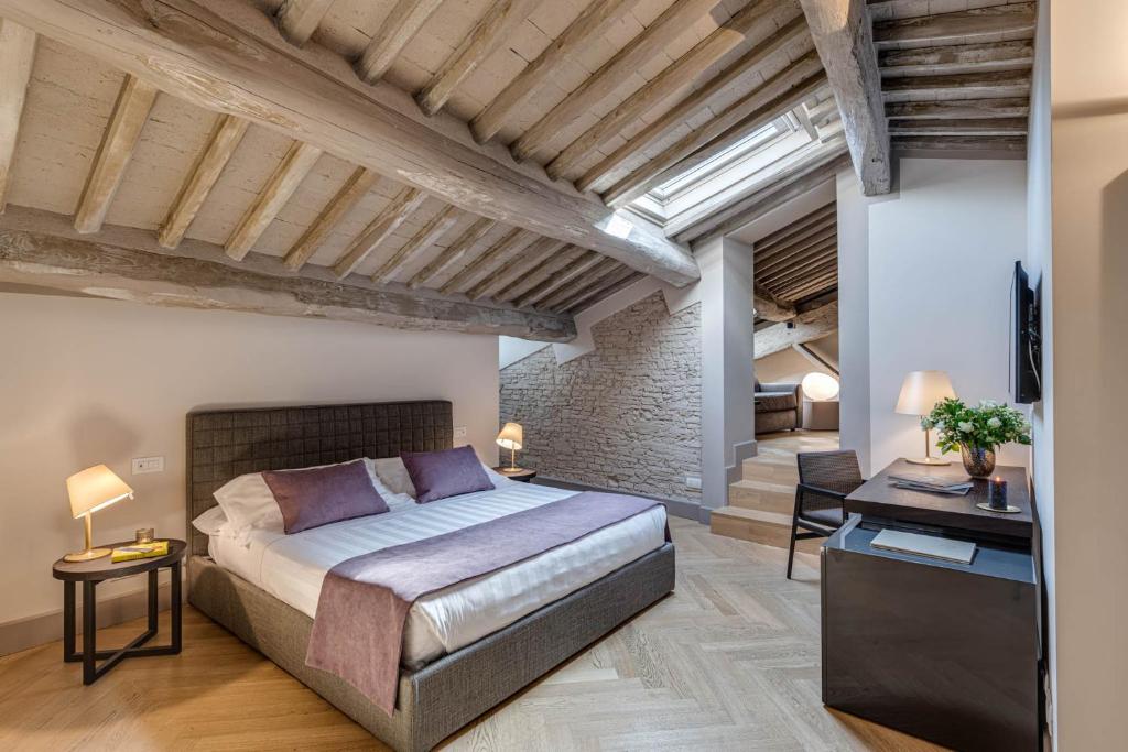 Postel nebo postele na pokoji v ubytování Palazzo Dipinto