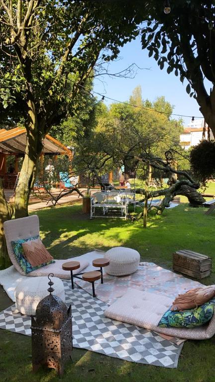 a picnic area with a table and chairs in a park at Oporto Loft in Porto