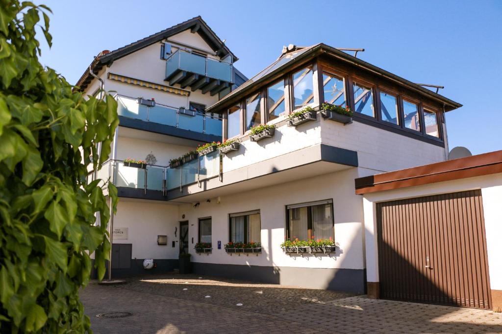 a house with balconies on the side of it at Haus Storck in Neustadt an der Weinstraße