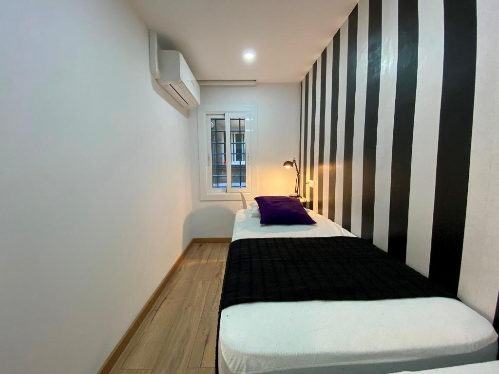 A bed or beds in a room at Besos Beach Gem II By MyRentalHost