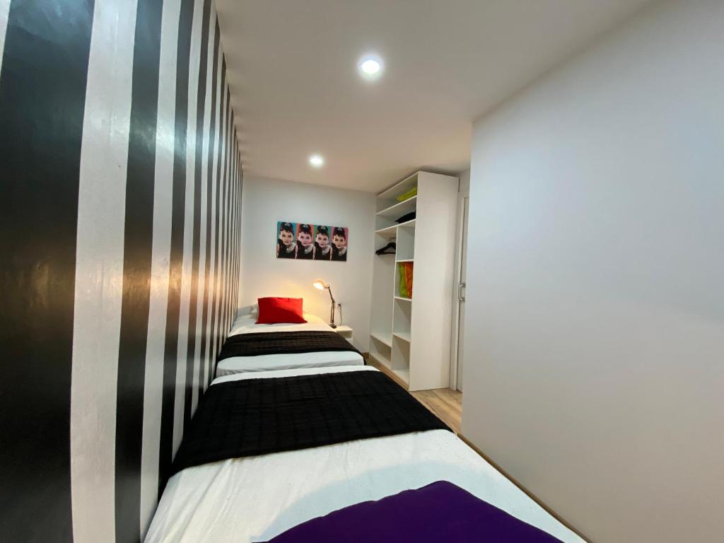 A bed or beds in a room at Besos Beach Gem II By MyRentalHost
