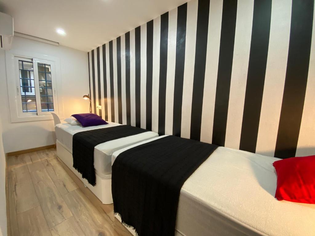 A bed or beds in a room at Besos Beach Gem II By MyRentalHost