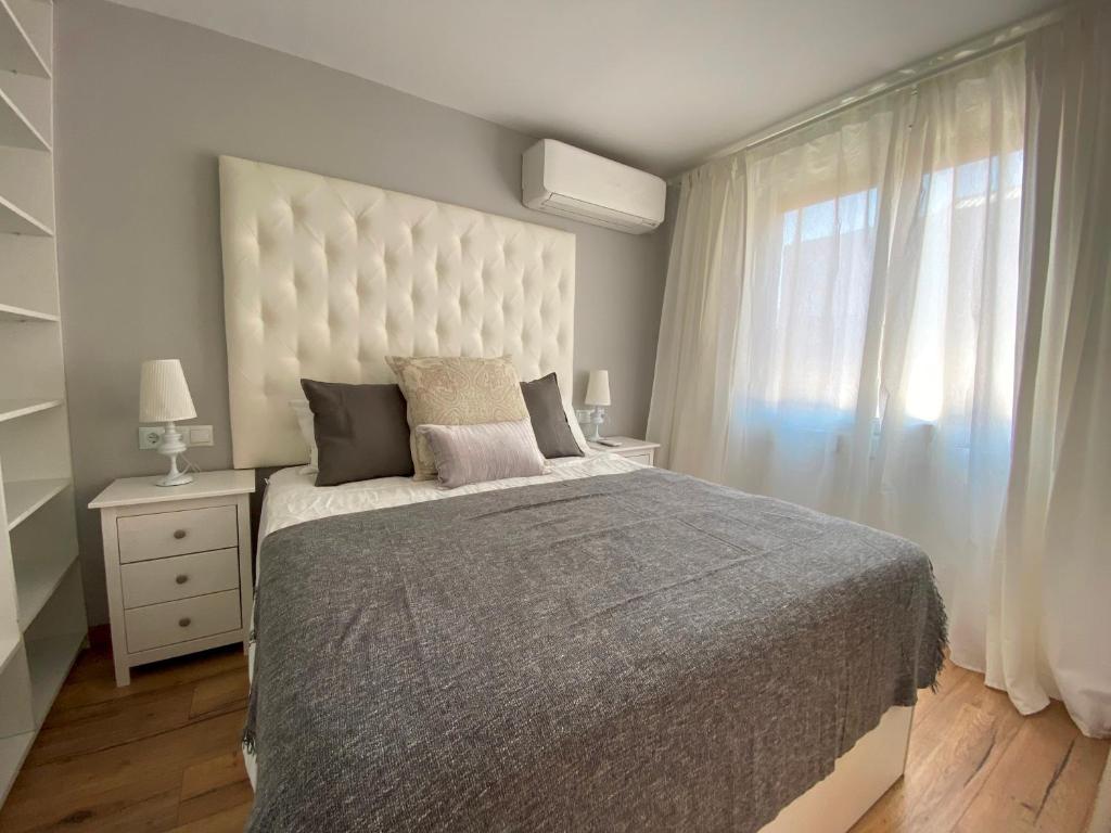 A bed or beds in a room at Besos Beach Gem II By MyRentalHost