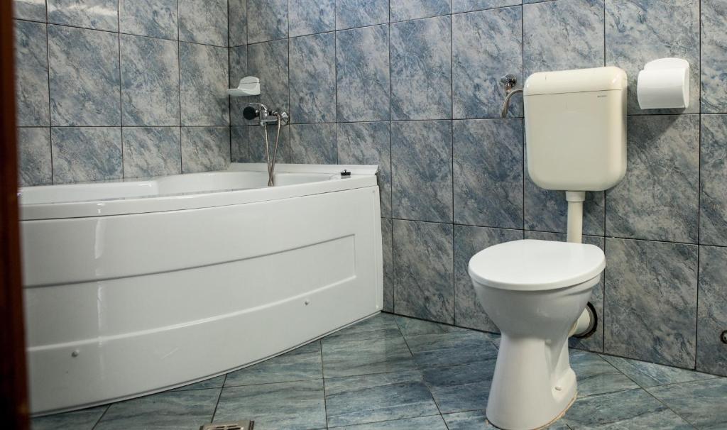 Koupelna v ubytování Hotel Allegro