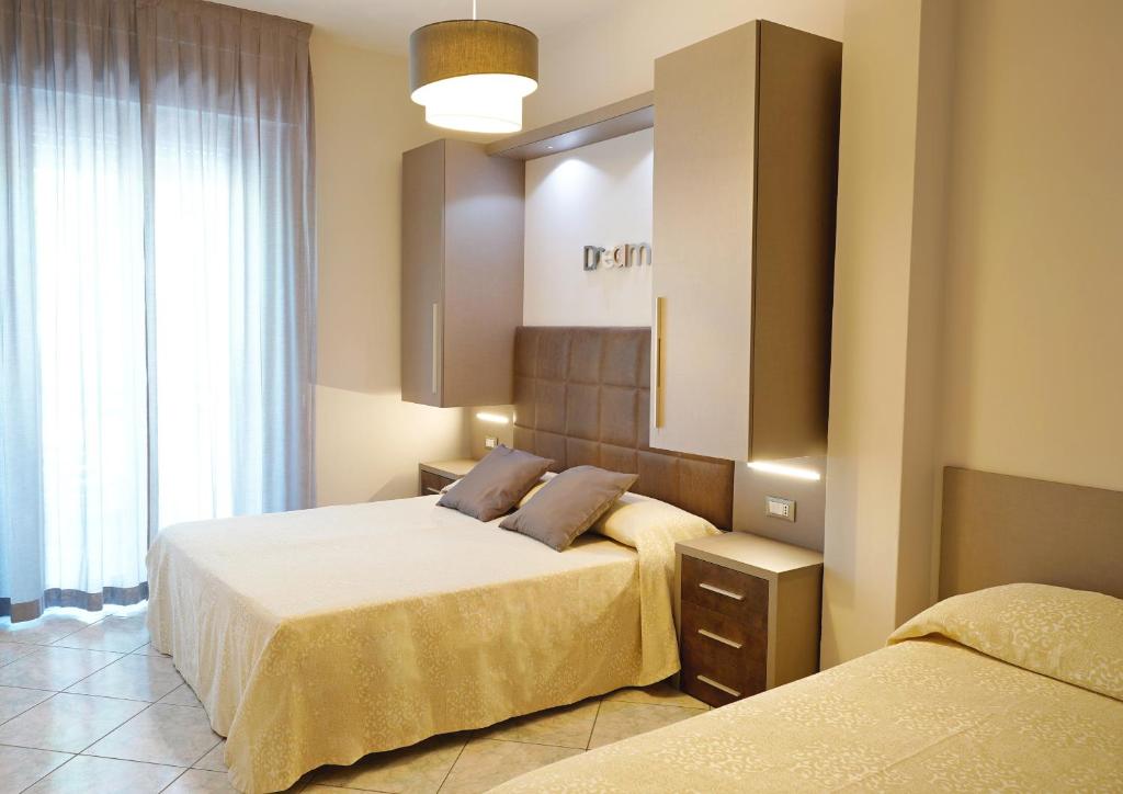 Postel nebo postele na pokoji v ubytování Hotel Fernanda