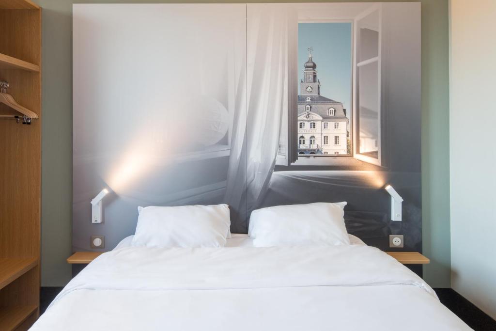 Postel nebo postele na pokoji v ubytování B&B HOTEL Freyming-Merlebach