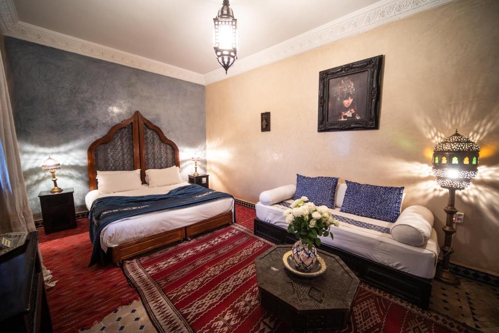 Postel nebo postele na pokoji v ubytování Riad Mur Akush