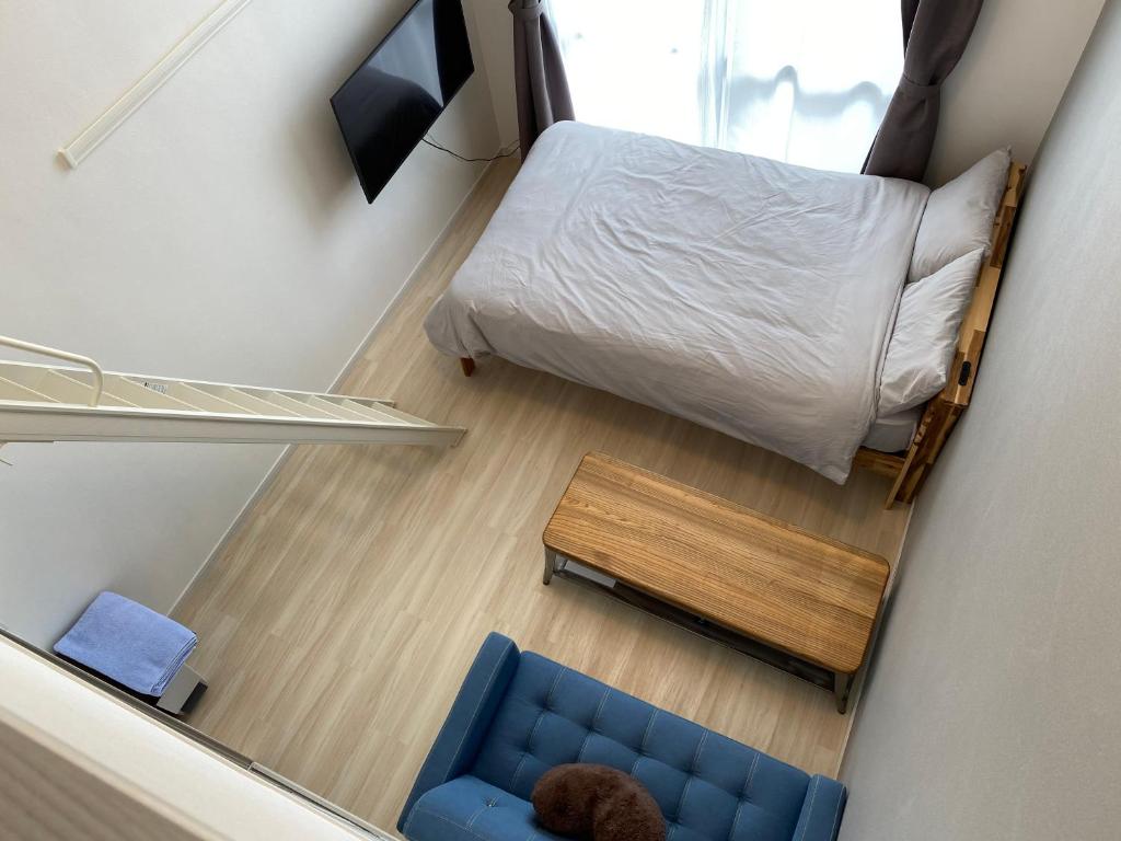 Кровать или кровати в номере ホテルトーマス牧港ヴィラ