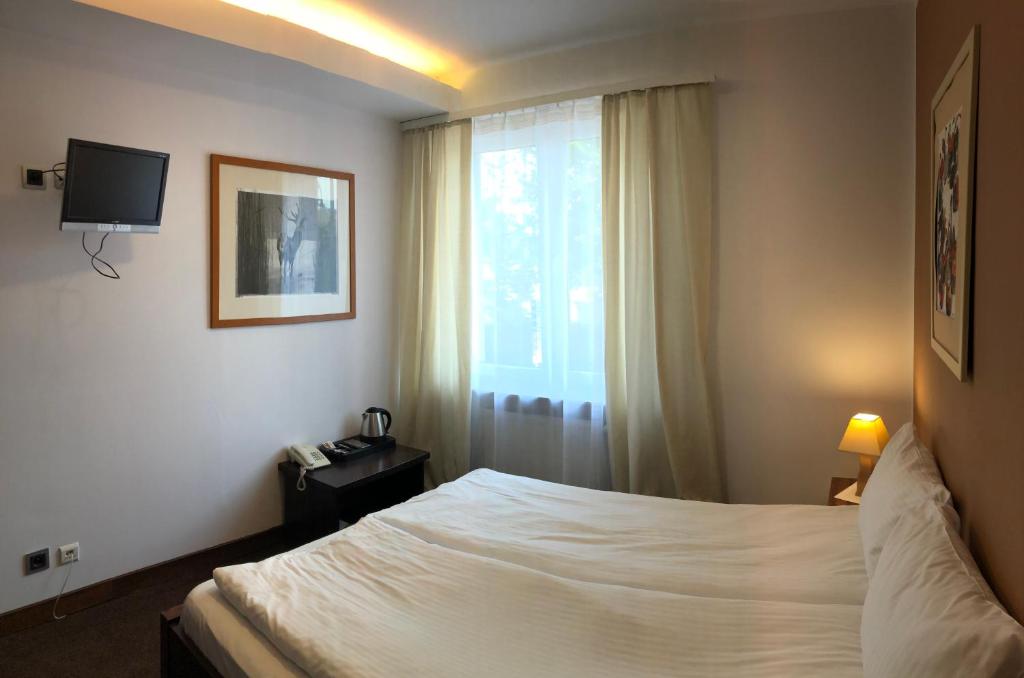 Кровать или кровати в номере Hotel Olecki