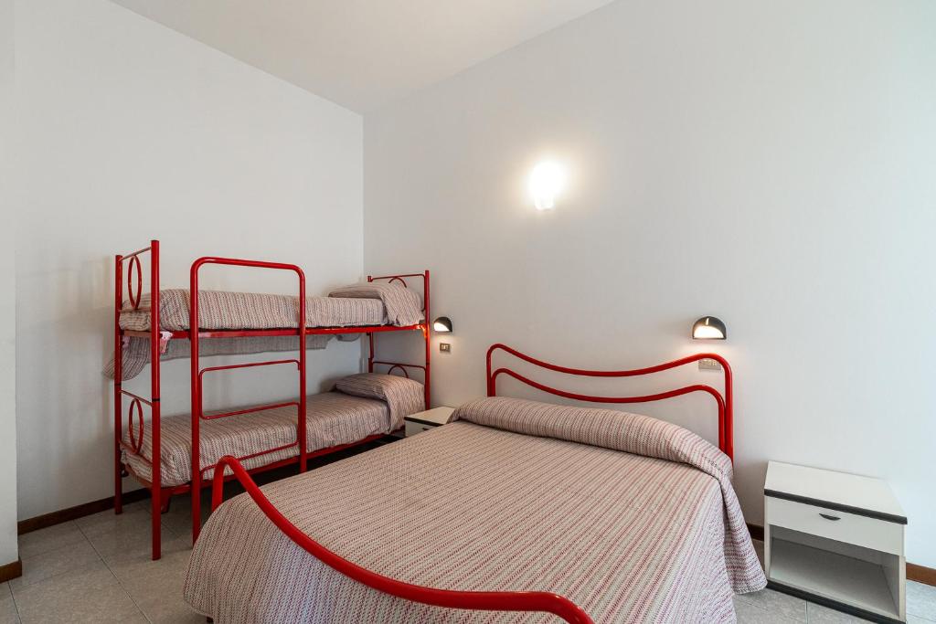 A bed or beds in a room at Residenza Casa del Sole