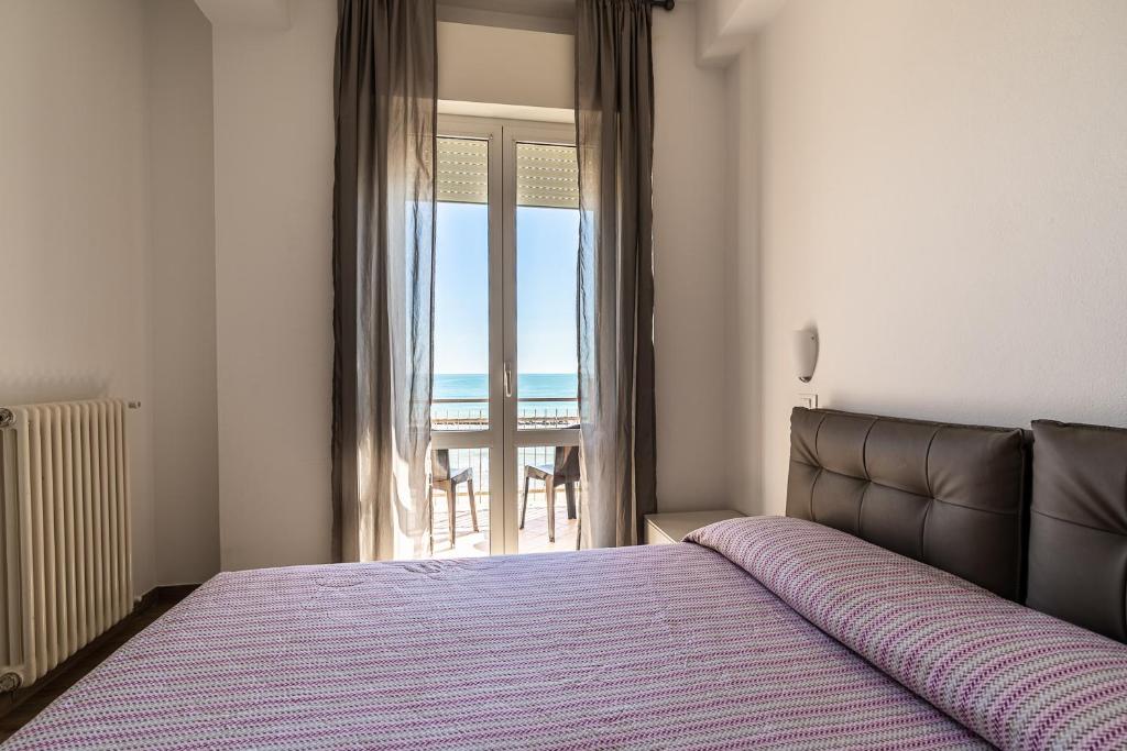 A bed or beds in a room at Residenza Casa del Sole