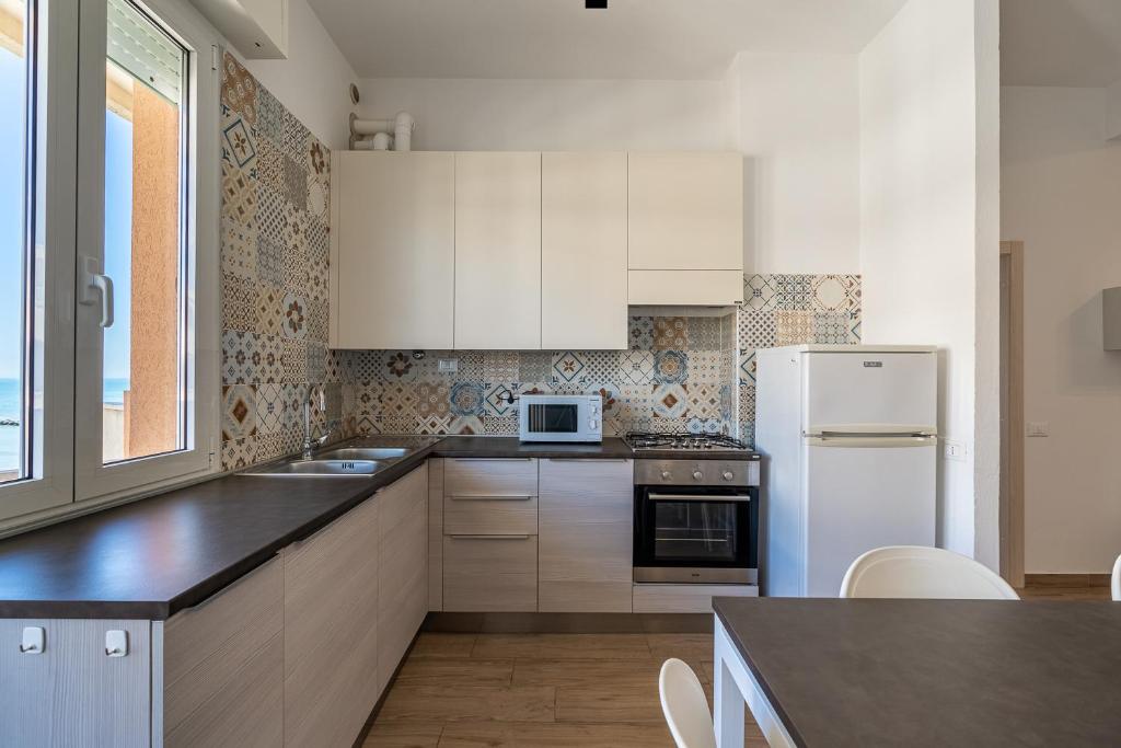 A kitchen or kitchenette at Residenza Casa del Sole
