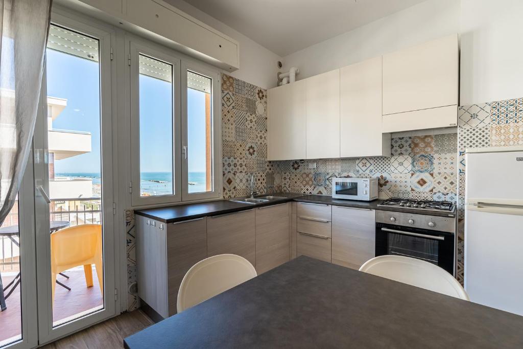 A kitchen or kitchenette at Residenza Casa del Sole