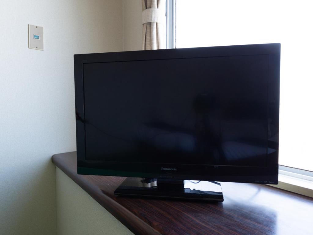 TV a/nebo společenská místnost v ubytování Tabist Business Hotel Chitose Kashiwazaki