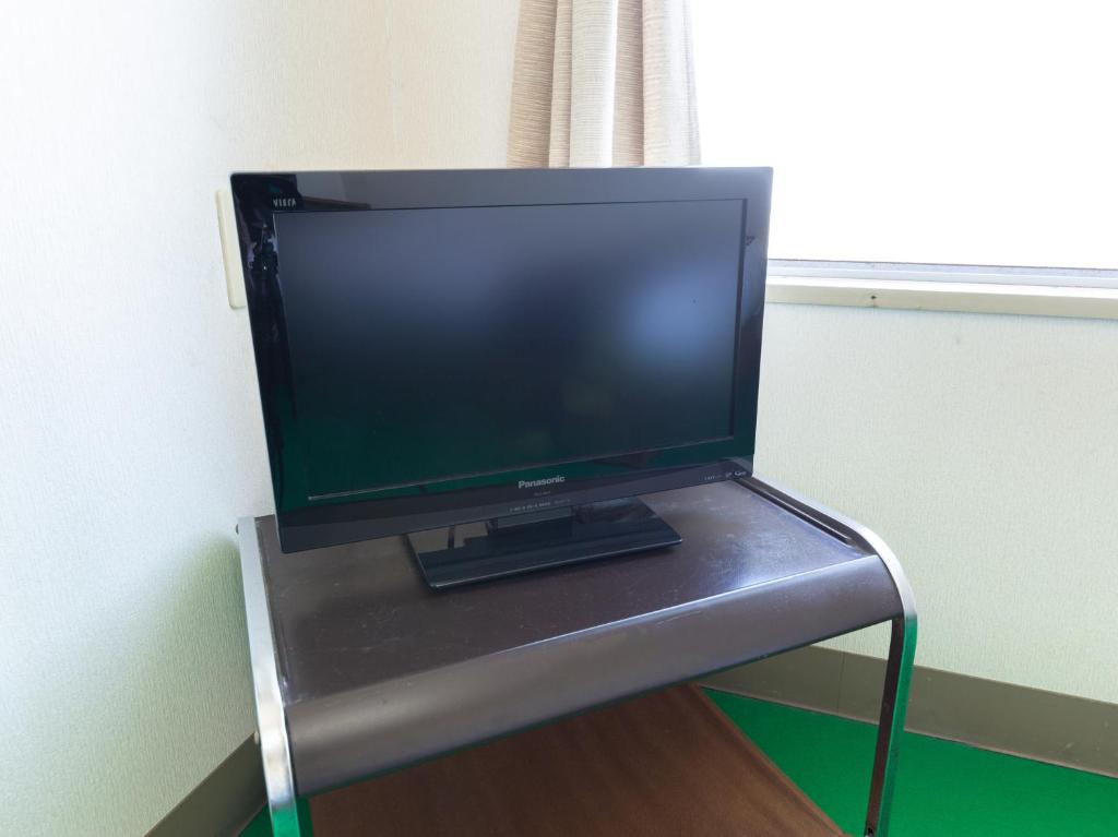 TV a/nebo společenská místnost v ubytování Tabist Business Hotel Chitose Kashiwazaki