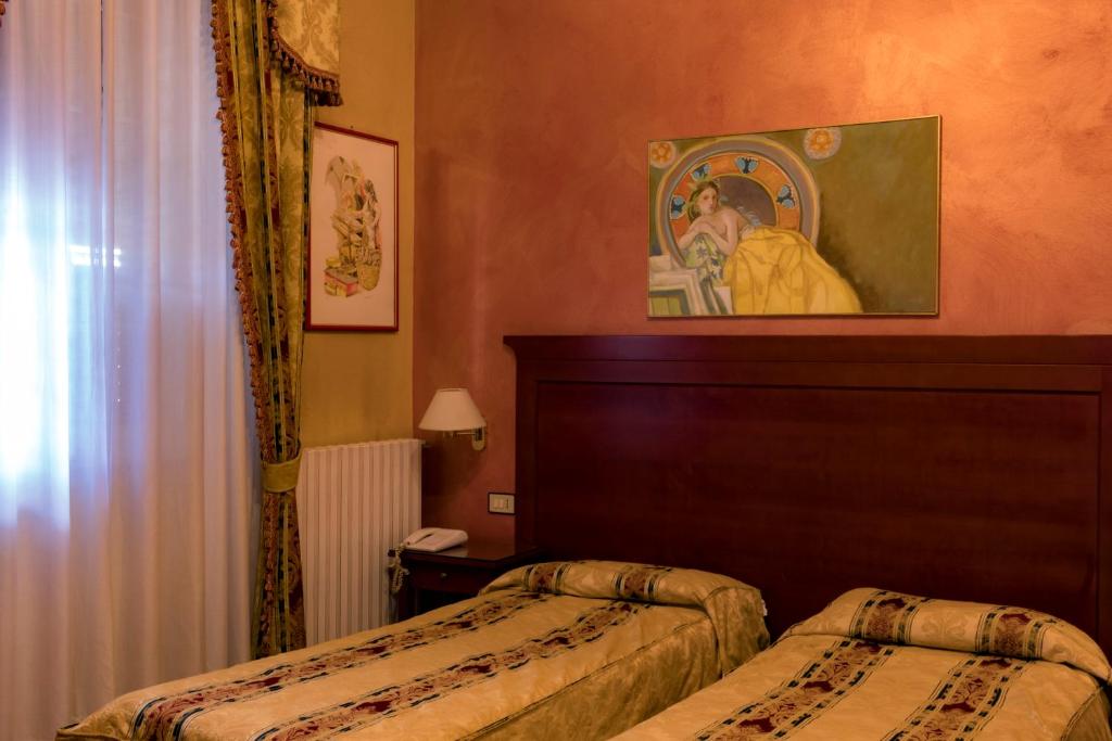 Postel nebo postele na pokoji v ubytování Hotel Joli