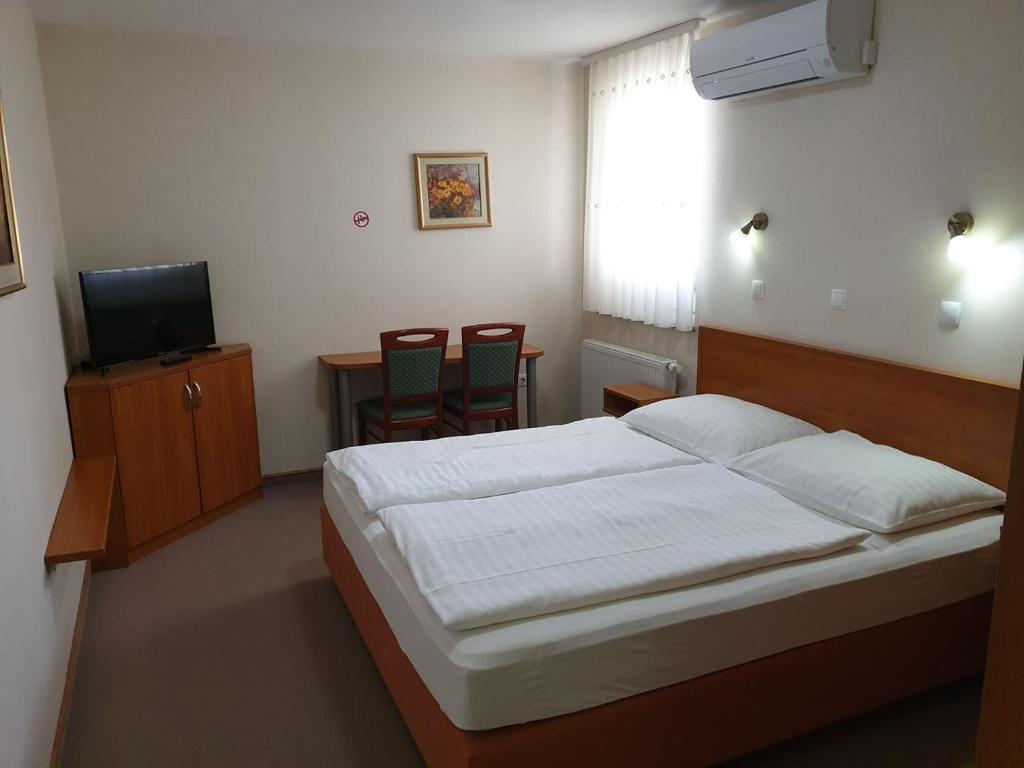 Postel nebo postele na pokoji v ubytování Dežman Apartments & Rooms