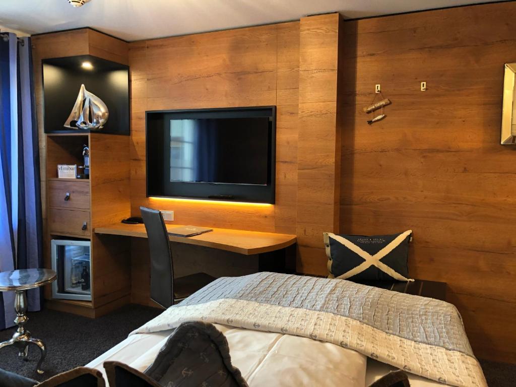 TV a/nebo společenská místnost v ubytování BLOCK Hotel & Living