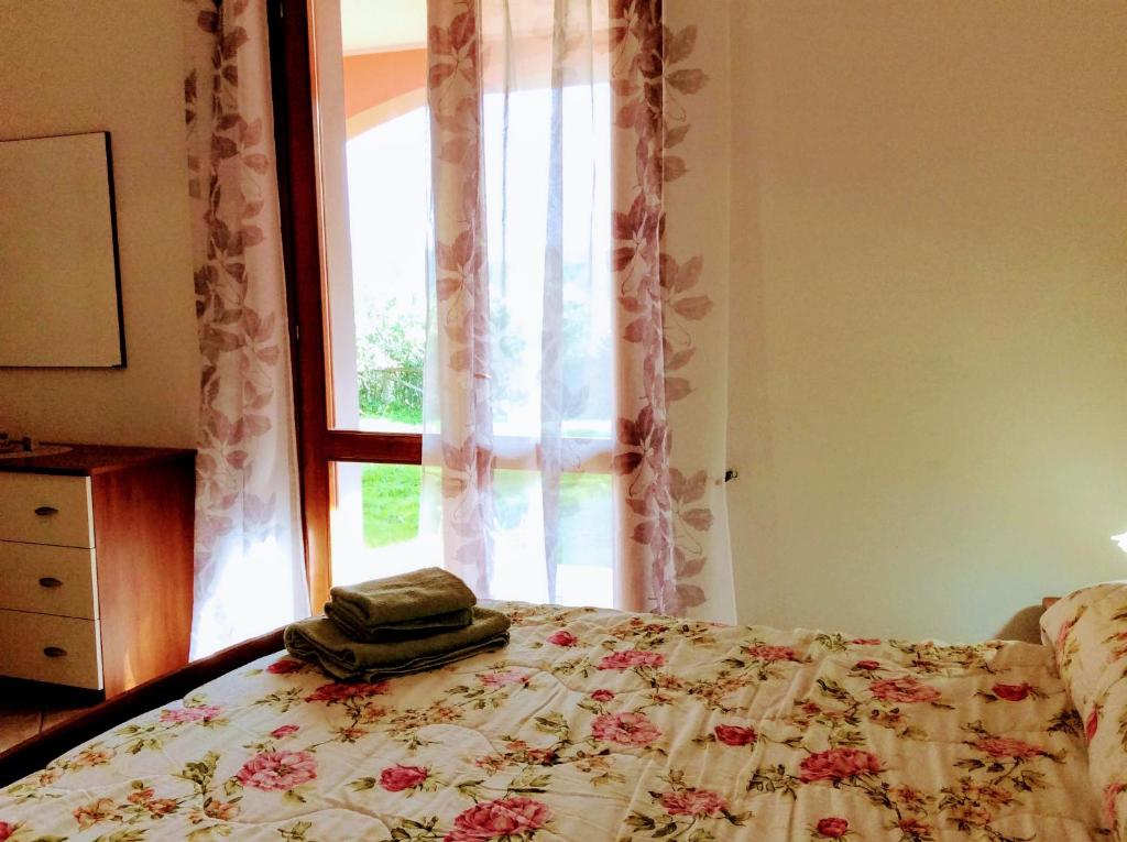 Postel nebo postele na pokoji v ubytování Il mirto e l'oleandro