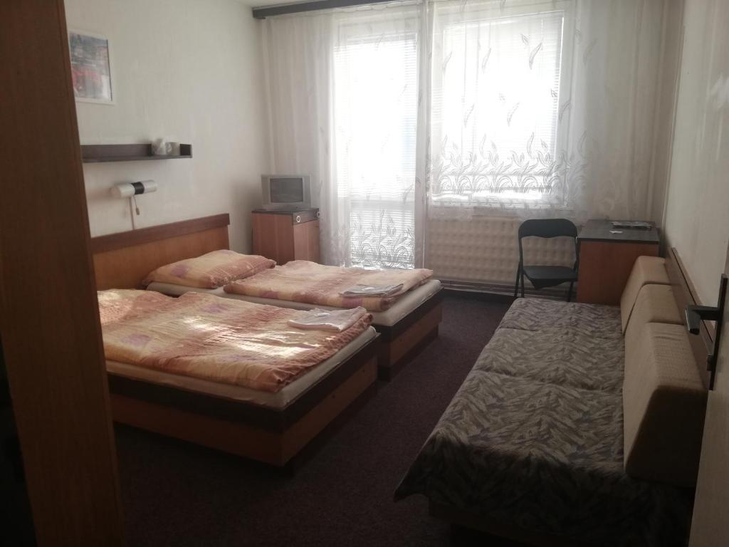 Postel nebo postele na pokoji v ubytování ABC Hotel Nitra