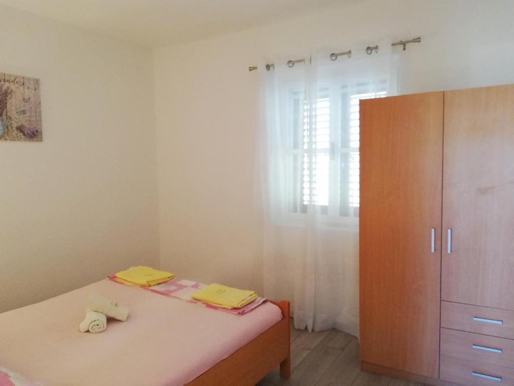 Posteľ alebo postele v izbe v ubytovaní Apartments Amfora