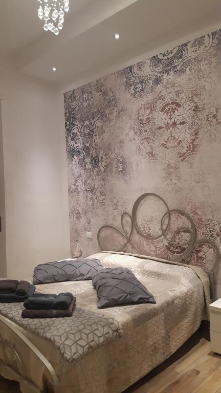 Säng eller sängar i ett rum på La Firenze Sogna