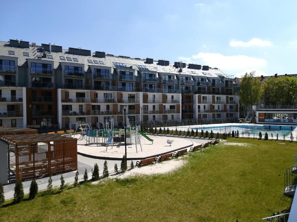 Bazén v ubytovaní Apartament Oaza Kołobrzeg-Podczele Kompleks Feniks basen siłownia jacuzii alebo v jeho blízkosti