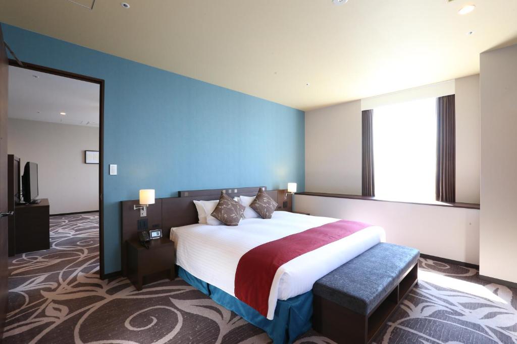 Postel nebo postele na pokoji v ubytování Quintessa Hotel Osaka Bay
