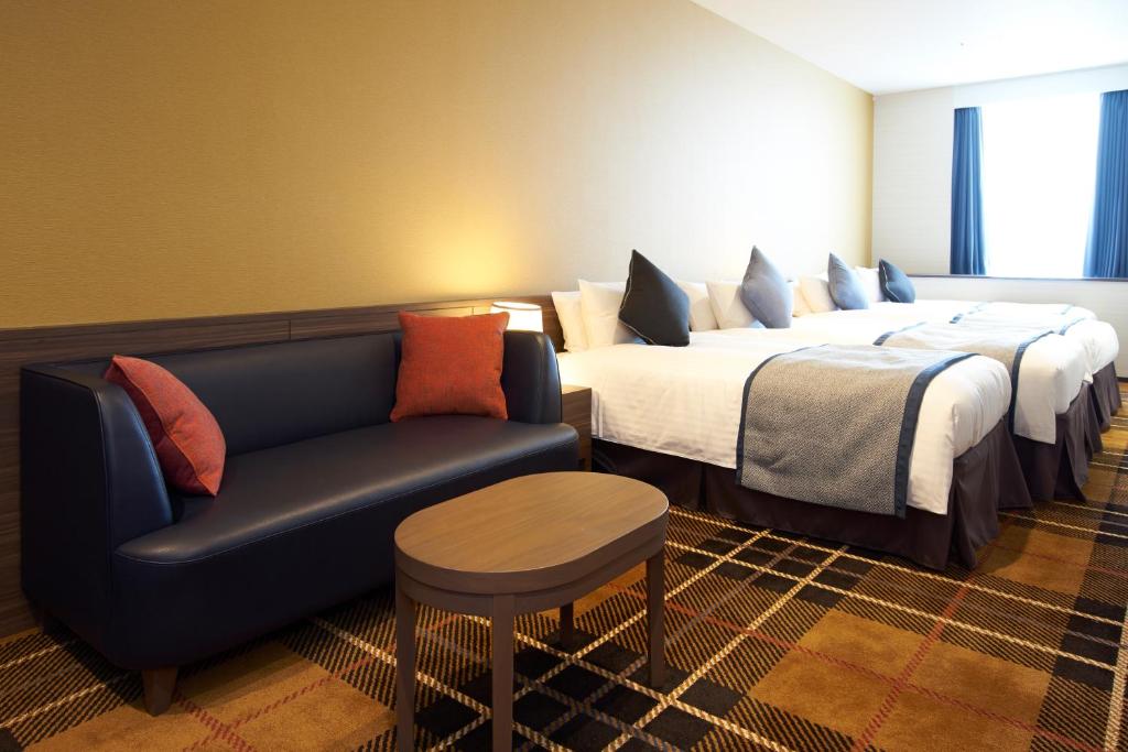 Postel nebo postele na pokoji v ubytování Quintessa Hotel Osaka Bay